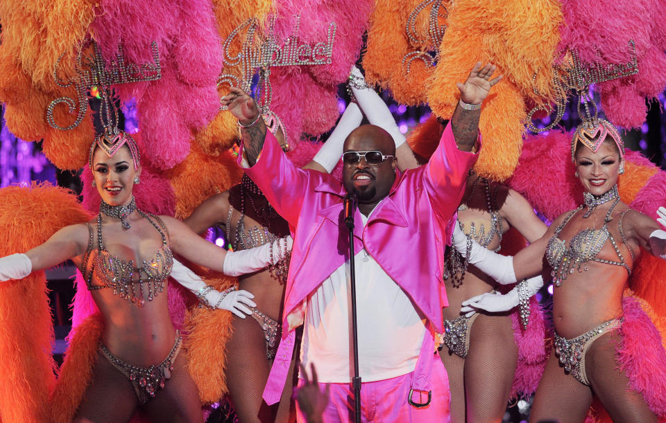 Cee Lo Green performs with the Jubilee! showgirls during the Caesars Entertainment "Escape To Total Rewards" concert in Los Angeles, Thursday, March 1, 2012. Simultaneous concert events were held in New York, Chicago, New Orleans and Los Angeles. (AP Photo/Chris Pizzello)