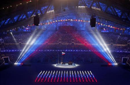 The Russian flag is being raised during the opening ceremony of the 2014 Sochi Winter Olympics, February 7, 2014. REUTERS/David Gray