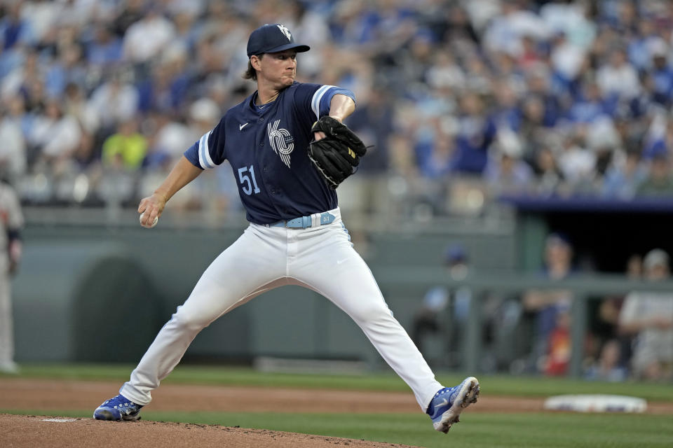 Kansas City Royals starting pitcher Brady Singer throws during the first inning of a baseball game against the Atlanta Braves Friday, April 14, 2023, in Kansas City, Mo. (AP Photo/Charlie Riedel)