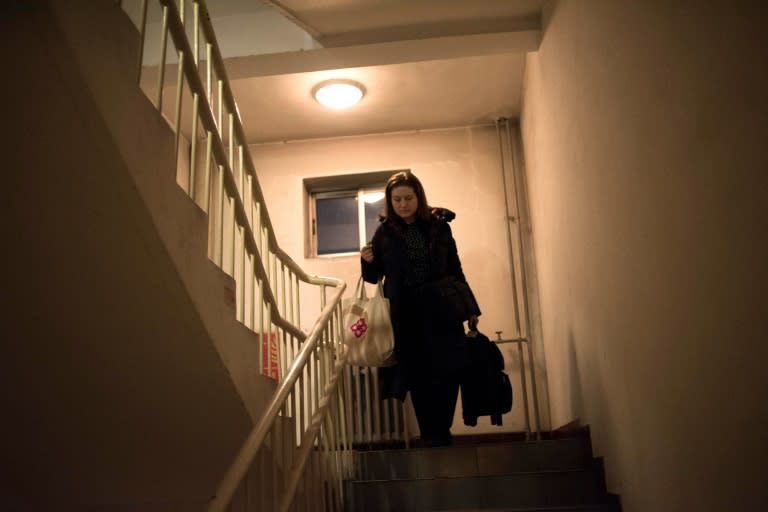 Ursula Gauthier leaves her apartment to take her flight back to France, in Beijing on December 31, 2015