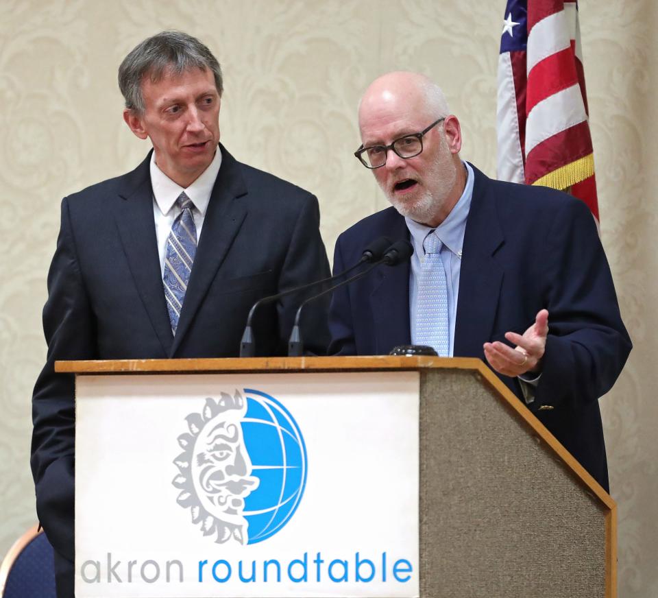 Daniel J. Flannery, right, director of the Begun Center for Violence Prevention at Case Western Reserve University, responds to audience questions voiced by Dr. Brian Harte, president of Cleveland Clinic Akron General, at Thursday's Akron Roundtable.