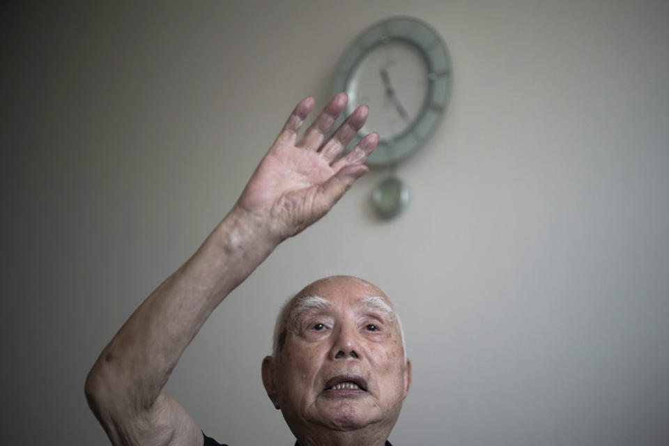 Hidekazu Tamura, 99, speaks during an interview with the Associated Press in Tokyo Thursday, Aug. 20, 2020. Amid commemorations for Wednesday's 75th anniversary of the formal Sept. 2 surrender ceremony that ended WWII, Tamura, a former Japanese American living in California, has vivid memories of his time locked up with thousands of other Japanese-Americans in U.S. intern camps. Torn between two warring nationalities, the experience led him to refuse a loyalty pledge to the United States, renounce his American citizenship and return to Japan. (AP Photo/Eugene Hoshiko)