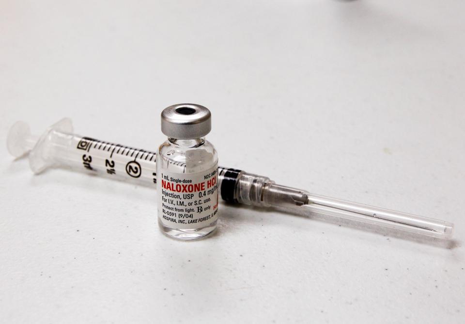 A vial of Naloxone and syringe are pictured at a Naloxone training class taught by Jennifer Stepp and her daughter Audrey for adults and children to learn how to save lives by injecting Naloxone into people suffering opioid overdoses at the Hillview Community Center in Louisville, Kentucky, November 21, 2015. REUTERS/John Sommers II