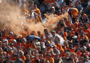 Fans of Red Bull driver Max Verstappen of the Netherlands celebrate on the stands during the qualifying session for the Hungarian Formula One Grand Prix, at the Hungaroring racetrack in Mogyorod, Hungary, Saturday, July 31, 2021. The Hungarian Formula One Grand Prix will be held on Sunday. (David W Cerny/Pool via AP)