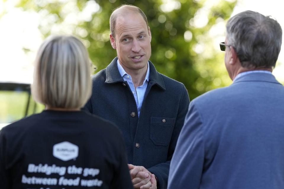 <p>AP Photo/Alastair Grant</p> Prince William is greeted as he arrives for a visit to Surplus to Supper