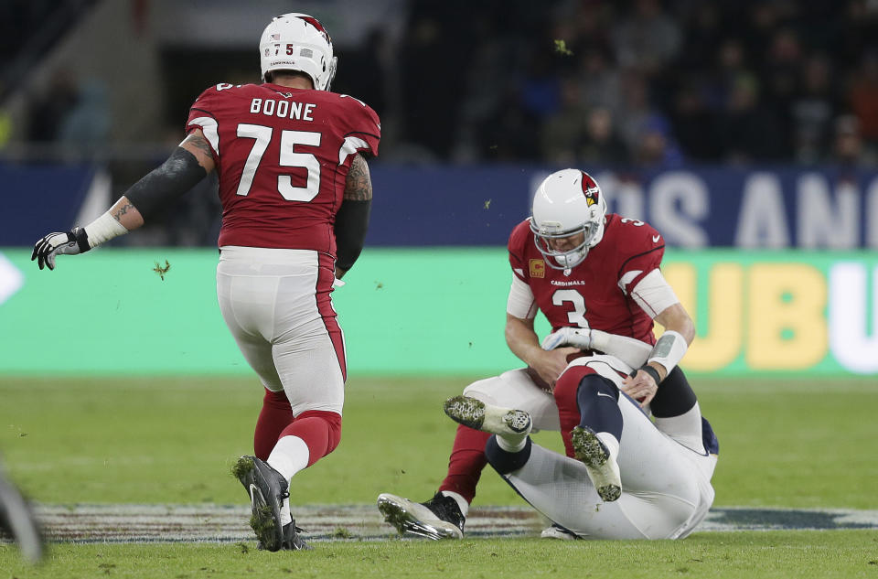 Cardinals quarterback Carson Palmer is sacked during the first half of Sunday’s game with the Los Angeles Rams. (AP)