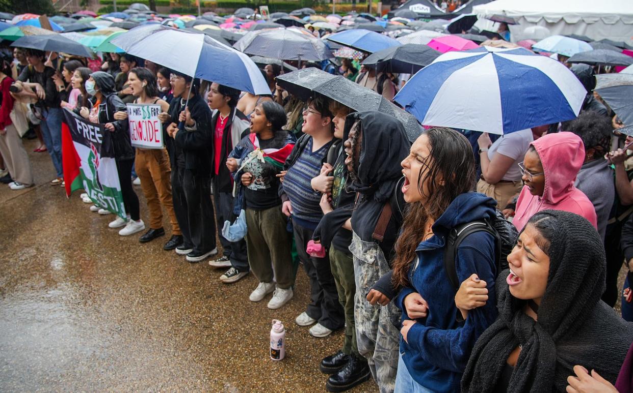 Thousands of University of Texas students demonstrated in front of Gregory Gymnasium and the UT Tower on campus in the rain Thursday, Nov. 9, 2023. There was a demonstration of support for Palestinians. As part of a demonstration to the University of Texas administration, UT students demonstrated that they oppose genocide and are complicit in enabling Israel's oppression. They also demanded the university to create a more inclusive environment for Palestinians on campus.