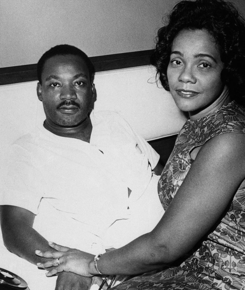 Dr. Martin Luther King and his wife Coretta discuss his condition with newsmen at his downtown hotel room in Jackson, Mississippi on August 12, 1966. King, who was there for the annual meeting of his Southern Christian Leadership Conference, missed key activities because of a virus ailment. (AP Photo)
