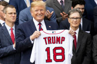 WASHINGTON, DC - MAY 9: U.S. President Donald Trump is presented with a Boston Red Sox jersey during a visit to the White House in recognition of the 2018 World Series championship on May 9, 2019 in Washington, DC. (Photo by Billie Weiss/Boston Red Sox/Getty Images) *** Local Caption *** Donald Trump