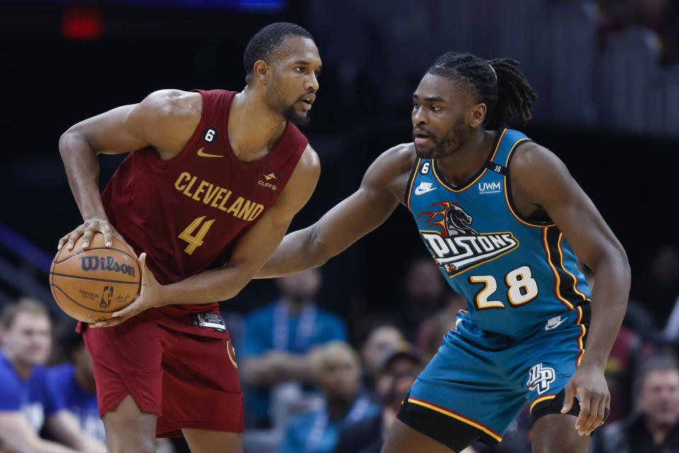 Cleveland Cavaliers forward Evan Mobley (4) plays against Detroit Pistons center Isaiah Stewart (28) during the first half of an NBA basketball game, Wednesday, Feb. 8, 2023, in Cleveland. (AP Photo/Ron Schwane)