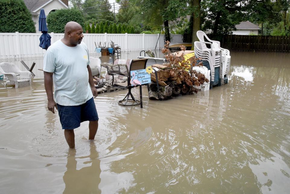 Andrew Johnson of Monroe stands in his backyard which was flooded by heavy storms on Aug. 24. Monroe County residents who had storm damage in August can apply for FEMA funding through the extended deadline of May 8.