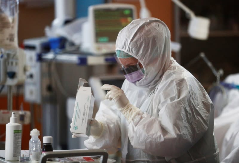 Medical workers in protective suits treat patients suffering with coronavirus disease (COVID-19) in Rome