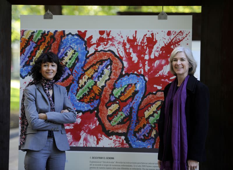 FILE PHOTO: French microbiologist Emmanuelle Charpentier (L) and professor Jennifer Doudna of the U.S. pose for the media during a visit to a painting exhibition by children about the genome, at the San Francisco park in Oviedo