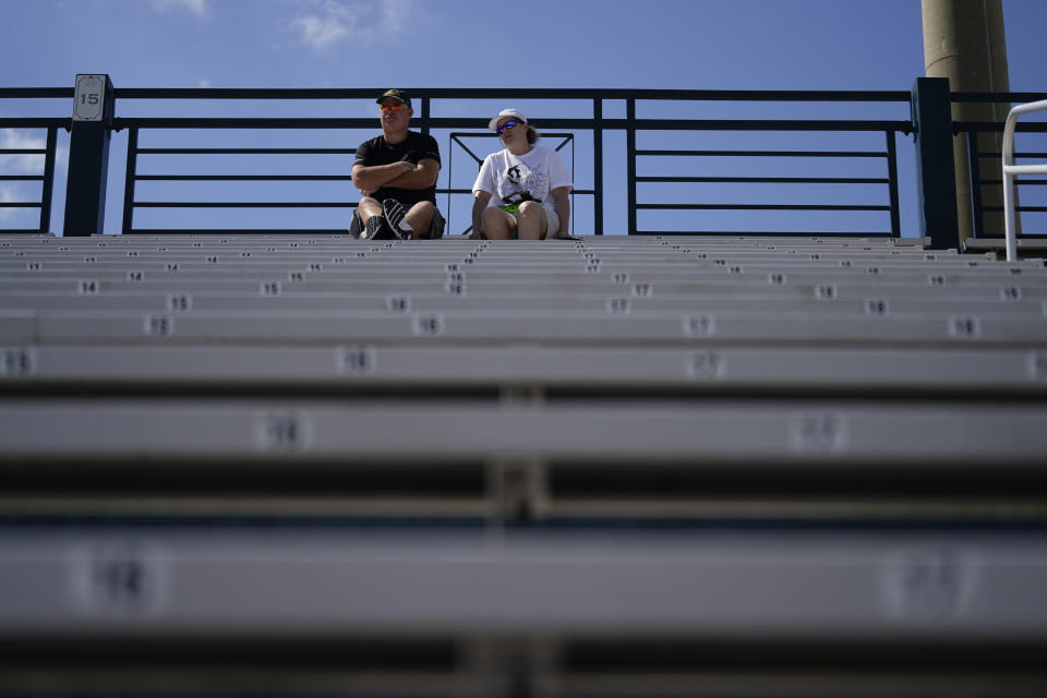 Baseball fans watch the Baltimore Orioles and the Pittsburgh Pirates play during a spring training baseball game, Tuesday, Feb. 28, 2023, in Bradenton, Fla. (AP Photo/Brynn Anderson)