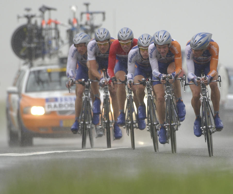 In this photo taken on July 7, 2004, the Rabobank cycling team with Erik Dekker, third from left, Levi Leipheimer of the US, third from right, and Michael Boogerd, far right, rides during the Tour de France cycling race team trial from Cambrai to Arras, France. The Rabobank cycling team announced Friday Oct. 19, 2012, it would pull out of professional cycling by the end of 2012 after reading the scathing report of the US anti doping watchdog USADA detailing the use of banned substances on a large scale in the peloton. Eleven teammates of Lance Armstrong on the U.S. Postal Service Cycling Team have turned on him offering evidence and testimony to back up allegations that Armstrong used performance-enhancing drugs in competition, the USADA said. (AP Photo/Peter Dejong)