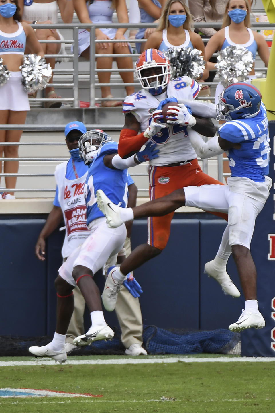 Florida tight end Kyle Pitts (84) catches touchdown pass over Mississippi defensive backs A.J. Finley (21) and Jaylon Jones (38) during the second half of an NCAA college football game in Oxford, Miss., Saturday, Sept. 26, 2020. No. 5 Florida won 51-35. (AP Photo/Thomas Graning)