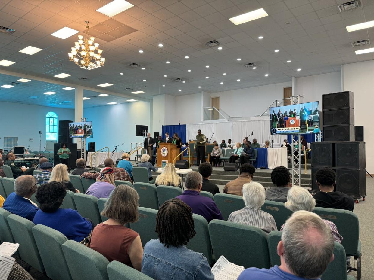 Community members attend the third annual Nehemiah Action Meeting hosted by the Capital Area Justice Ministry to hear how local commissioners stand on gun violence and affordable housing.