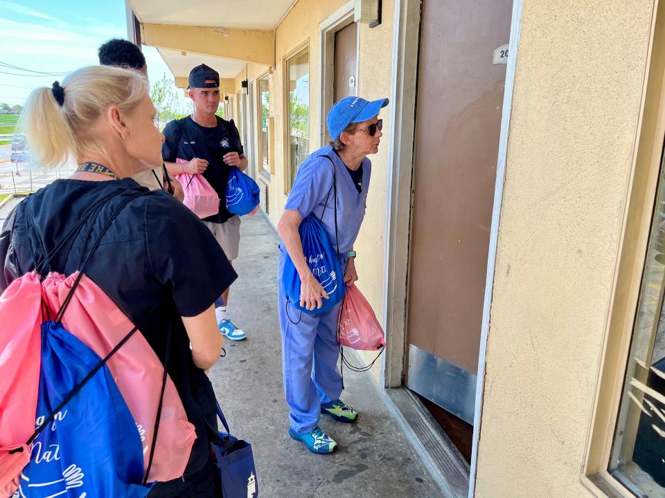 Dr. Sandra Gibney and other outreach workers make house calls to those staying at the Budget Inn on Thursday, April 20, 2023. They handed out food and the opioid-reversing drug naloxone.