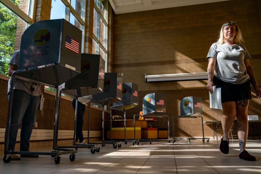 GRAND RAPIDS, MI - AUGUST 02: Voters cast their ballots at a precinct on Michigan's Primary Election Day at Coit Creative Arts Elementary School on Tuesday, Aug. 2, 2022 in Grand Rapids, MI. Voters in Michigan will cast their ballots for the first time in districts that were newly drawn by a new nonpartisan redistricting committee. (Kent Nishimura / Los Angeles Times)