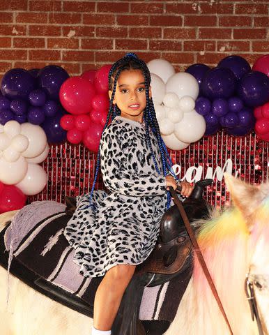 <p>Monique Green</p> Dream Kardashian poses on a pony at her 7th birthday party with mom Blac Chyna