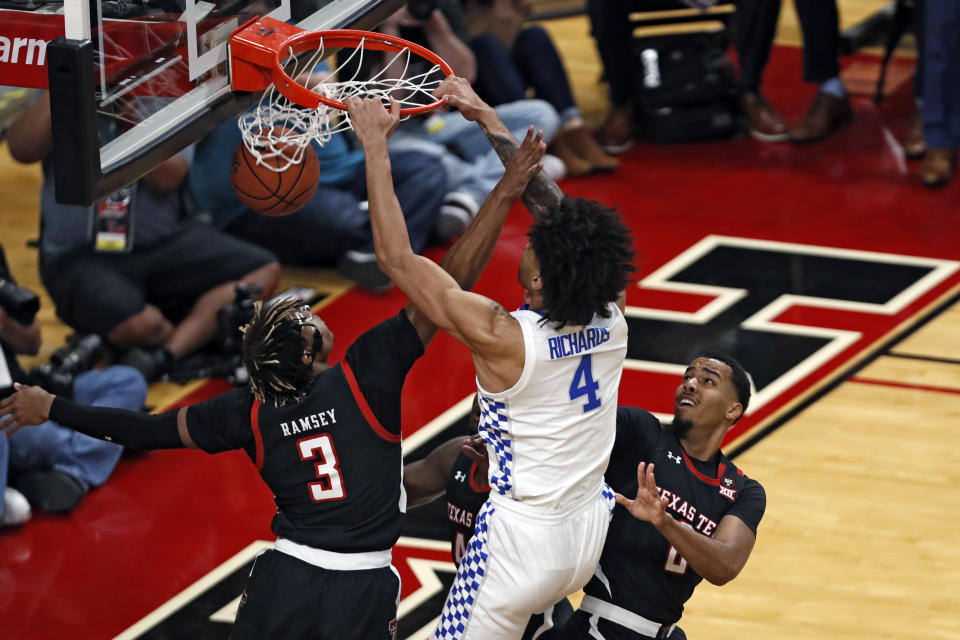 Kentucky's Nick Richards (4) dunks the ball during the first half of an NCAA college basketball game against Texas Tech, Saturday, Jan. 25, 2020, in Lubbock, Texas. (AP Photo/Brad Tollefson)
