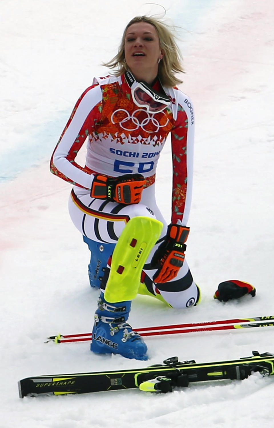 Germany's Maria Hoefl-Riesch kneels in the snow after the slalom run of the women's alpine skiing super combined event at the 2014 Sochi Winter Olympics at the Rosa Khutor Alpine Center February 10, 2014. Hoefl-Riesch came in first place. REUTERS/Dominic Ebenbichler (RUSSIA - Tags: SPORT SKIING OLYMPICS)