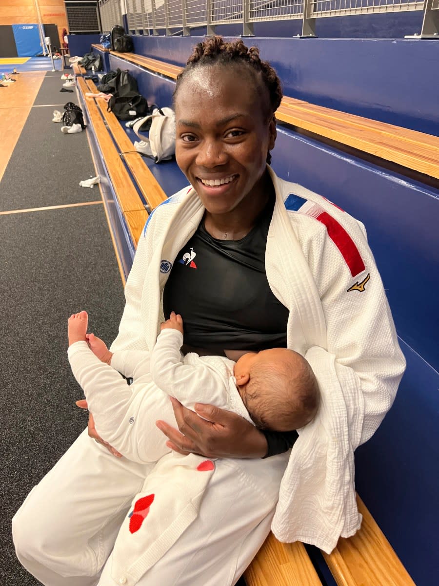 French judoka Clarisse Agbegnenou breast-feeds her baby Athena in an unknown location in France, Oct. 17, 2022. Breast-feeding and high-performance sports were long an almost impossible combination for women athletes, faced for decades with the cornelian choice of career or motherhood, because it was so tough to have both. But that’s becoming less true ahead of the first Summer Games where men and women will compete in equal numbers and with pioneering super-mums showing that it’s possible (Nadia Benabdelouamed via AP)