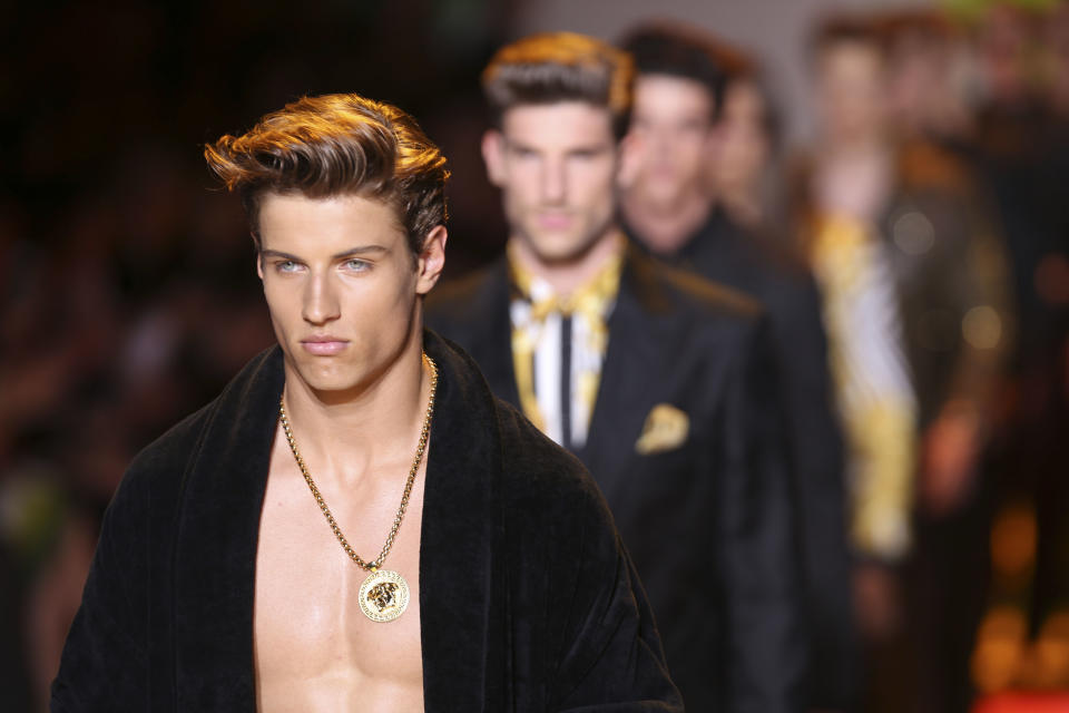 Models wear creations of the Versace men's Spring-Summer 2014 collection, part of the Milan Fashion Week, unveiled in Milan, Italy, Saturday, June 22, 2013. (AP Photo/Luca Bruno)