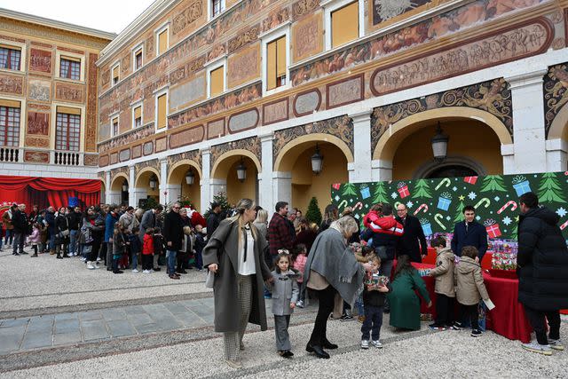 <p>Stephane Cardinale/PLS Pool/Getty</p> Festivities at the children's holiday party at the Prince's Palace of Monaco on Dec. 20.