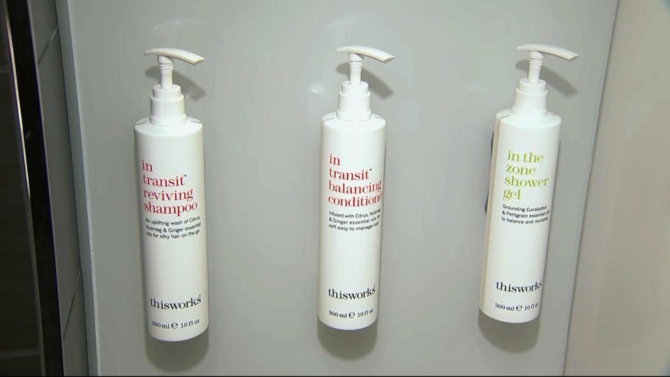 This image made from video shows bottles of shampoo, conditioner and shower gel that will replace smaller bottles of them by 2021, filmed at Marriott's headquarters in Bethesda, Md., Tuesday, Aug. 27, 2019. Marriott International, the world's largest hotel chain, said Wednesday it will eliminate small plastic bottles of shampoo, conditioner and bath gel from its hotel rooms worldwide by December 2020. They’ll be replaced with larger bottles or wall-mounted dispensers, depending on the hotel. (AP Photo/Dan Huff)