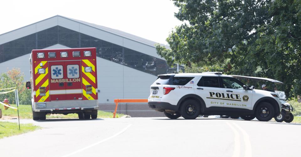 Massillon police and fire vehicles block an entrance to Washington High School following a bomb threat at the school.