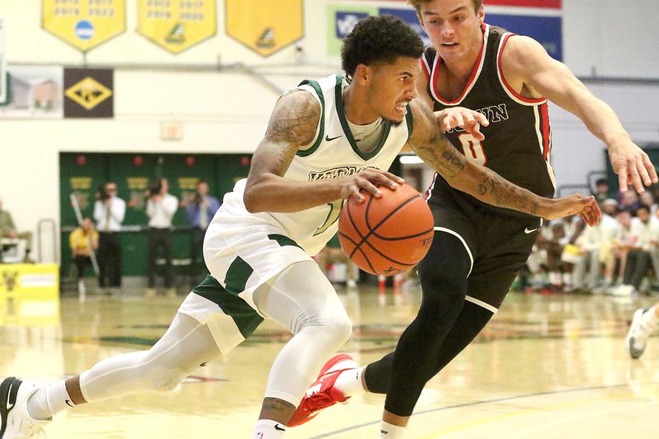 Vermont's Aaron Deloney drives to the basket during the Catamounts season opening 80-65 win over the Brown Bears on Monday night at UVM's Patrick Gym. Deloney led all scorers with a career high 32 points in the win.