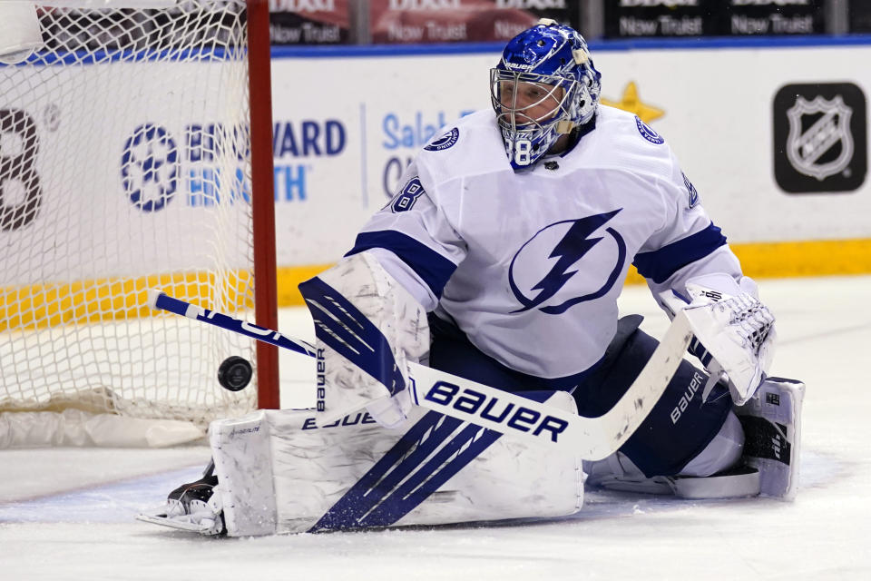 Tampa Bay Lightning goaltender Andrei Vasilevskiy stops the puck during the second period of an NHL hockey game against the Florida Panthers, Saturday, Feb. 13, 2021, in Sunrise, Fla. (AP Photo/Lynne Sladky)