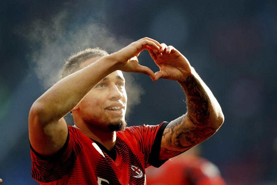 Milan's Noah Okafor celebrates after scoring their side's third goal of the game during the Serie A soccer match between AC Milan and AC Monza at San Siro stadium in Milan, Italy, Sunday Dec. 17, 2023. (Spada/LaPresse via AP)