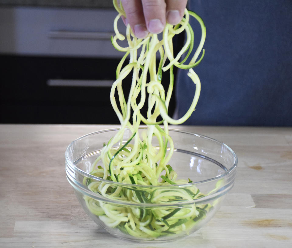 Use scissors to cut your long, spiralized zoodles into easier-to-eat pieces. (Courtesy Vidya Rao)