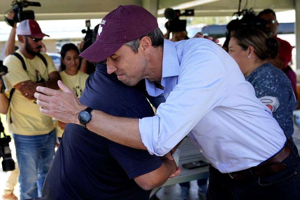 Texas Democratic gubernatorial candidate Beto O'Rourke, right, greets family of the Uvalde shooting massacre before a pre-campaign debate news conference, Friday, Sept. 30, 2022, in Edinburg, Texas. O'Rourke will face Gov. Greg Abbott in a debate Friday evening.