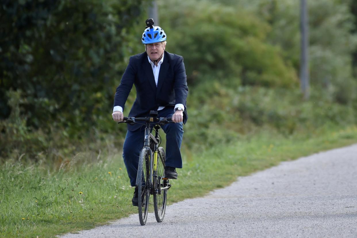 <p>File image of Boris Johnson on his bike at the Canal Side Heritage Centre in Beeston near Nottingham, in July 2020</p> (REUTERS)