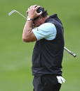 Phil Mickelson reacts after missing a putt on the 15th green during the second round of the Wells Fargo Championship golf tournament at Quail Hollow Club in Charlotte, N.C., Friday, May 7, 2021. (Jeff Siner/The Charlotte Observer via AP)