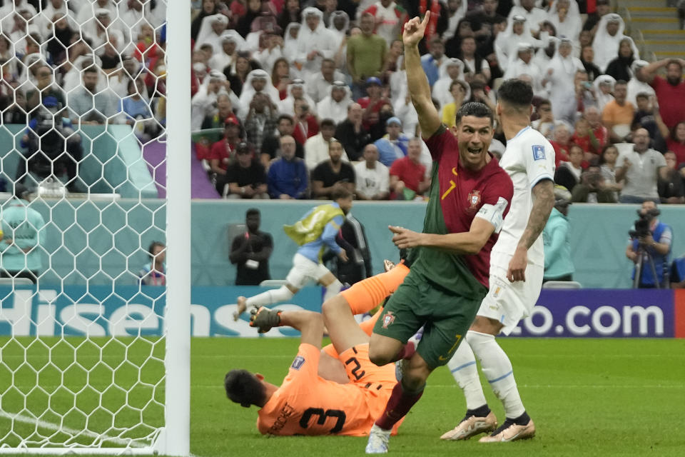 Portugal's Cristiano Ronaldo celebrates after scoring his side's opening goal during the World Cup group H soccer match between Portugal and Uruguay, at the Lusail Stadium in Lusail, Qatar, Monday, Nov. 28, 2022. (AP Photo/Themba Hadebe)