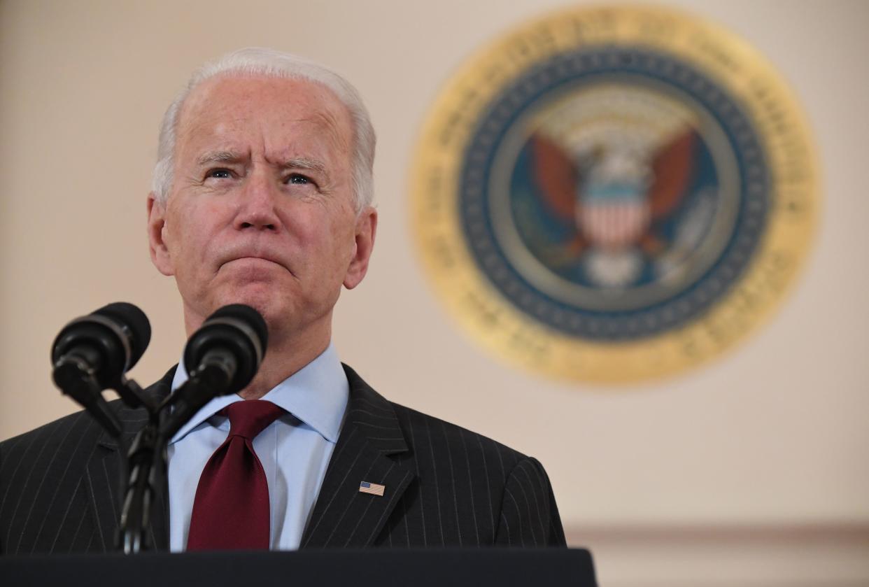 President Joe Biden speaks about lives lost to Covid after death toll passed 500,000, in the Cross Hall of the White House in Washington, DC, February 22, 2021. (Saul Loeb/AFP via Getty Images)