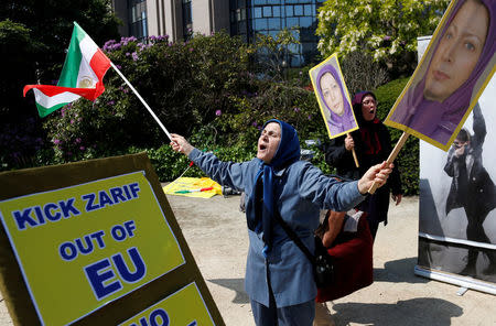 A protester chants slogans against the visit of Iran's Foreign Minister Mohammad Javad Zarif during a demonstration outside the European Union Council in Brussels, Belgium, May 15, 2018. REUTERS/Francois Lenoir