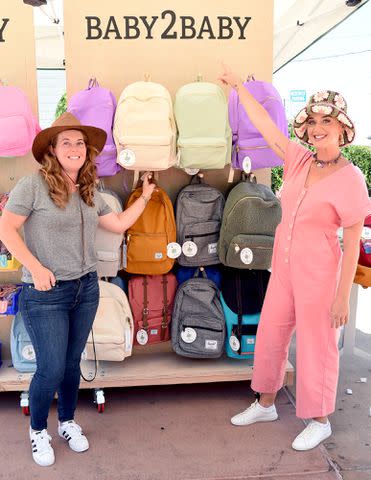 <p>Michael Kovac/Getty</p> Angela Hudson and Katy Perry attend Baby2Baby Back2School on July 21, 2021 in Los Angeles, California.