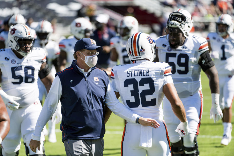 Auburn head coach Gus Malzahn walks across the field during halftime of an NCAA college football game against South Carolina, Saturday, Oct. 17, 2020, in Columbia, S.C. (AP Photo/Sean Rayford)