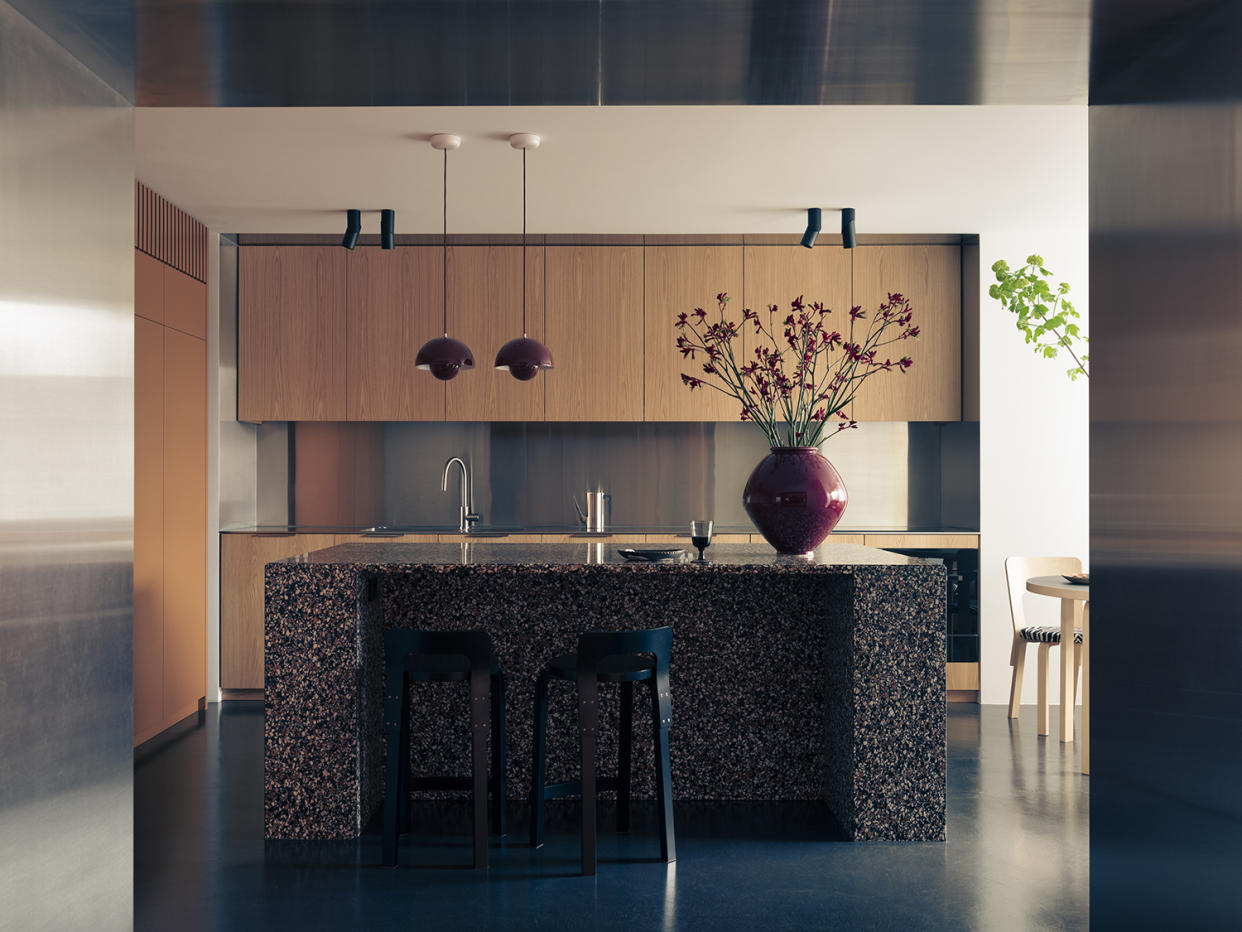  modern kitchen with terrazzo island and steel kitchen cabinets 