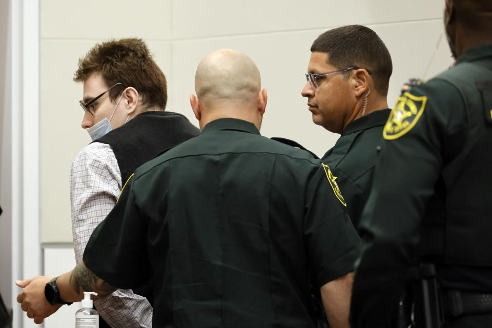 Marjory Stoneman Douglas High School shooter Nikolas Cruz is escorted from the courtroom during the penalty phase of Cruz's trial at the Broward County Courthouse in Fort Lauderdale on Thursday, Aug. 25, 2022. Cruz previously plead guilty to all 17 counts of premeditated murder and 17 counts of attempted murder in the 2018 shootings. (Amy Beth Bennett/South Florida Sun Sentinel via AP, Pool)