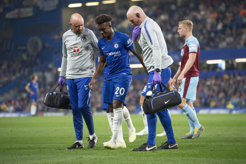 LONDON, ENGLAND - APRIL 22: Callum Hudson-Odoi of Chelsea is helped off the pitch by the Chelsea medical staff during the Premier League match between Chelsea FC and Burnley FC at Stamford Bridge on April 22, 2019 in London, United Kingdom. (Photo by Visionhaus/Getty Images)