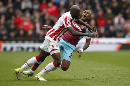 Britain Football Soccer - Stoke City v West Ham United - Premier League - bet365 Stadium - 29/4/17 West Ham United's Andre Ayew in action with Stoke City's Bruno Martins Indi Reuters / Andrew Yates Livepic