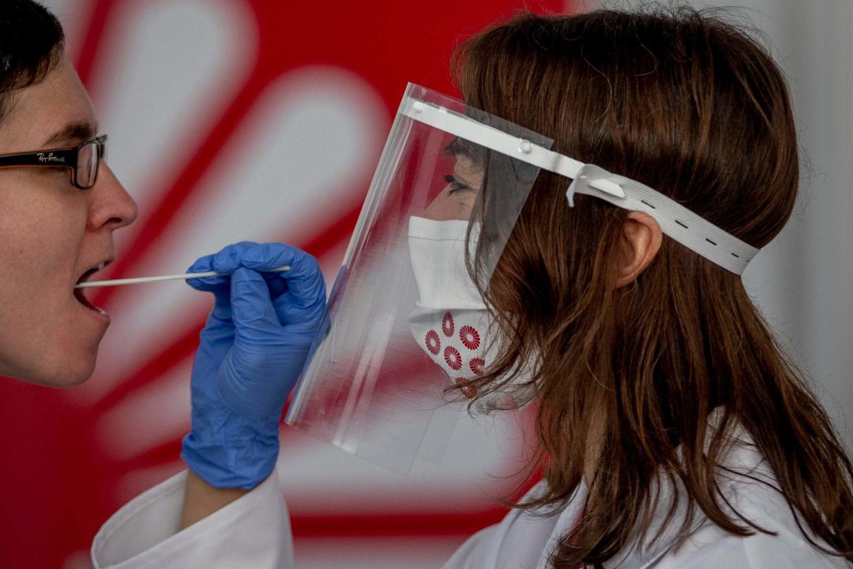 The Government is facing calls to introduce coronavirus testing at UK airports: AP