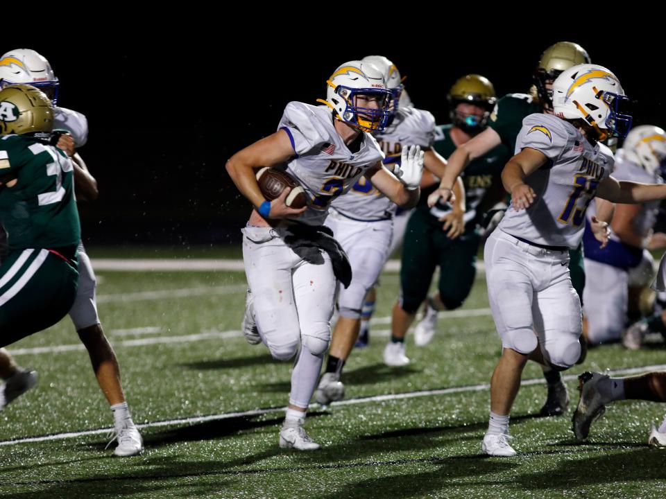 Talon Preston runs with the ball during Philo's 28-13 win against host Athens on Aug. 17, 2023, in The Plains.