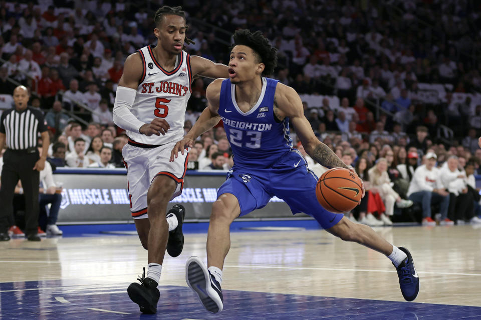 Creighton guard Trey Alexander (23) drives past St. John's guard Daniss Jenkins during the first half of an NCAA college basketball game Sunday, Feb. 25, 2024, in New York. (AP Photo/Adam Hunger)